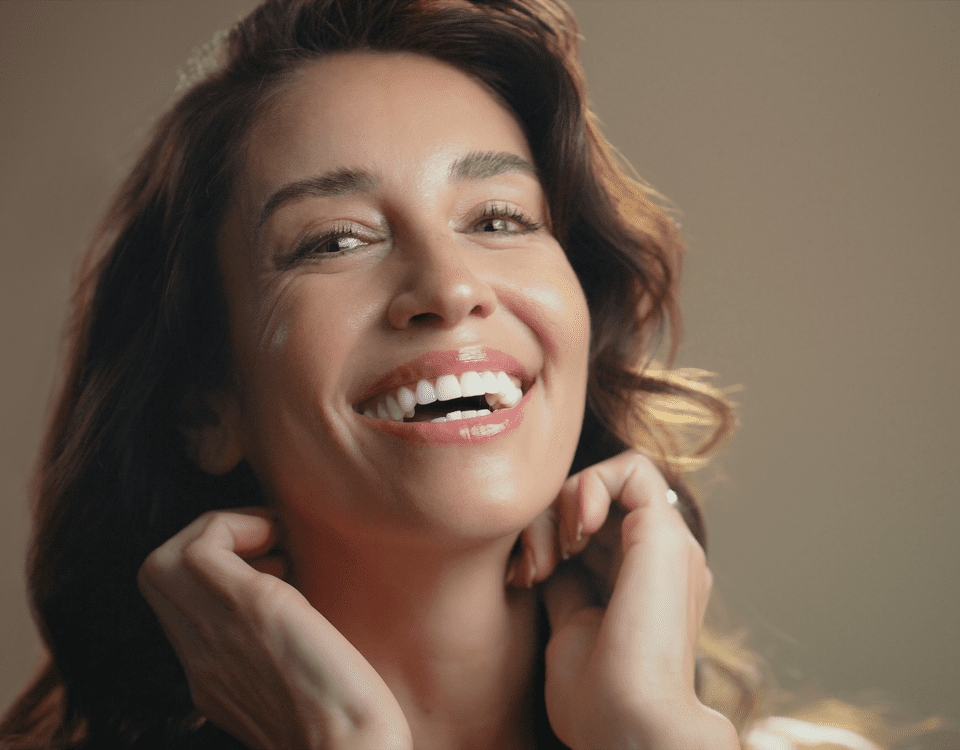 Woman laughing, displaying bright healthy smile